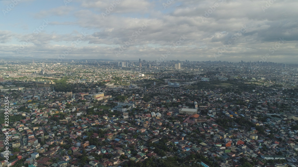 Obraz premium Aerial view of Manila city with skyscrapers and buildings. Philippines, Luzon. Aerial skyline of Manila.