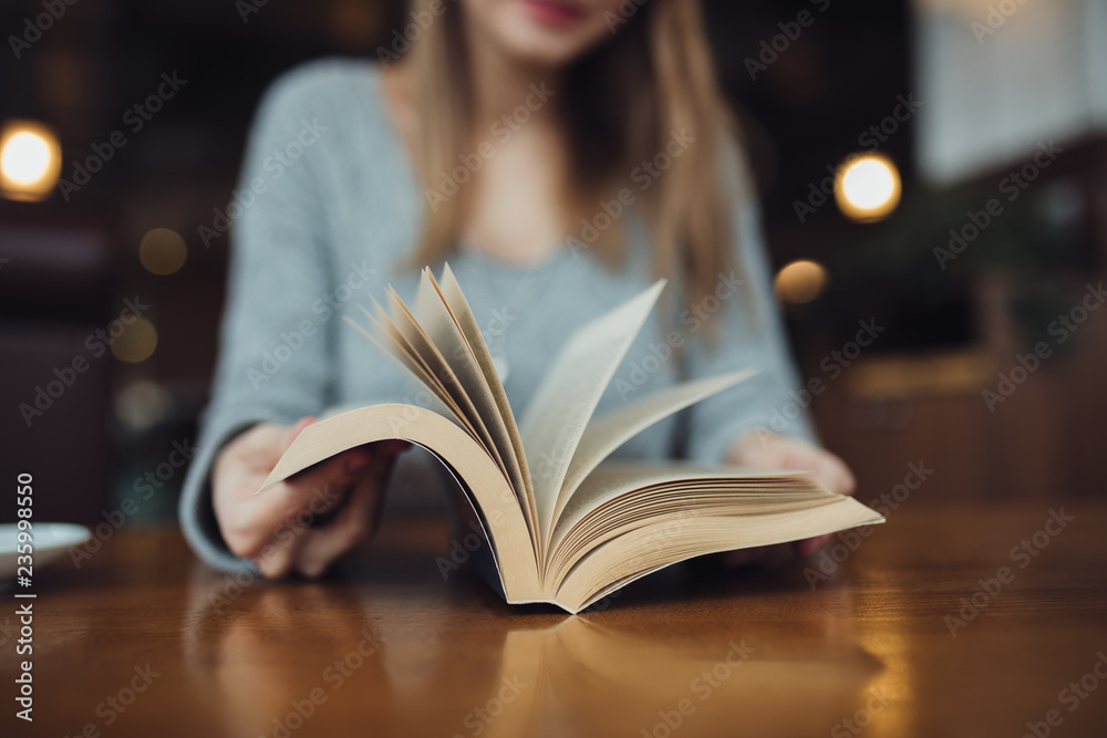 Woman turn pages in the book close up Woman turn pages in the book close up