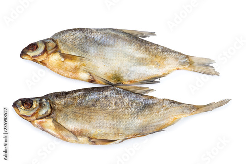 Dried salted fishes isolated on white backdrop.