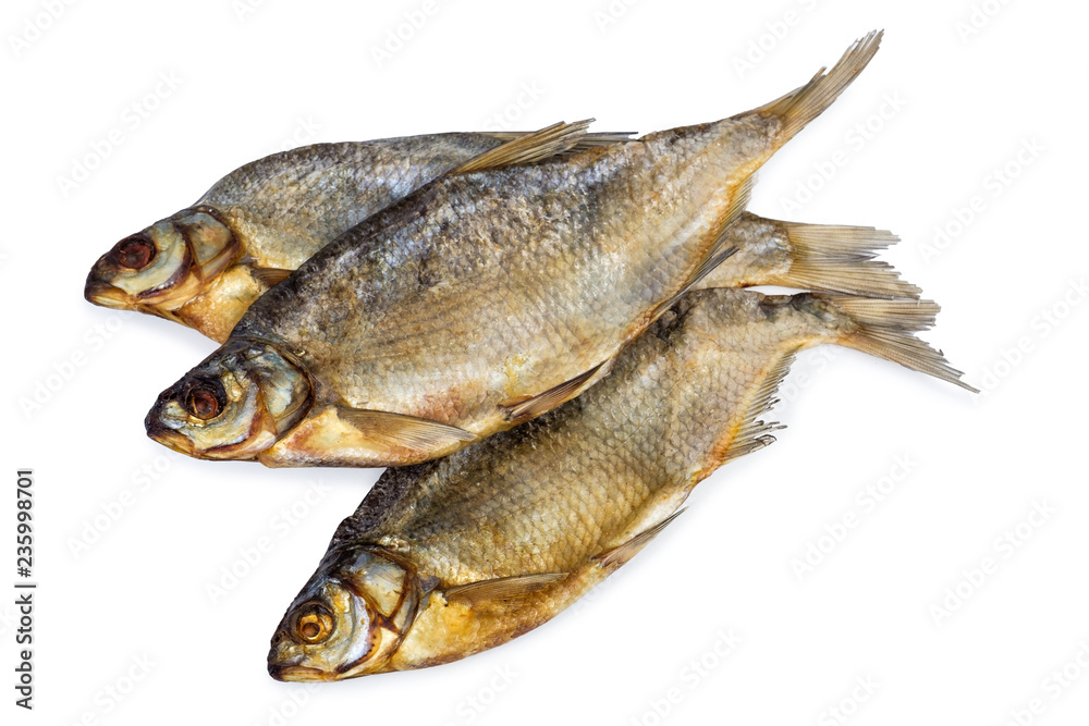 Three dried salted fishes isolated on a white background. Three dried salted fishes isolated on a white background.