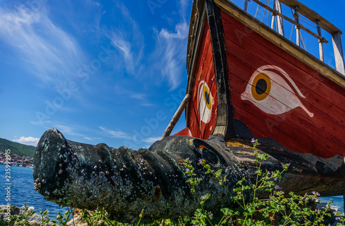 Historical wooden shipwreck reconstruction detail with bamboo on land, Urla, Izmir, Turkey. Ancient Greek culture, Kybele ship. eye pattern. photo