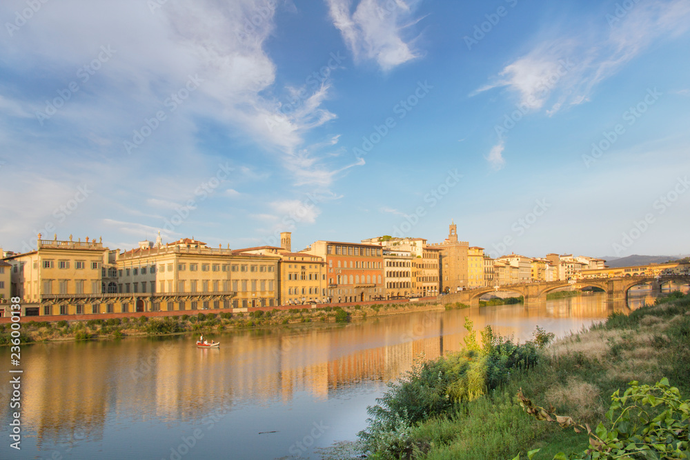 Beautiful view of the Ponte Vecchio bridge across the Arno River in Florence, Italy