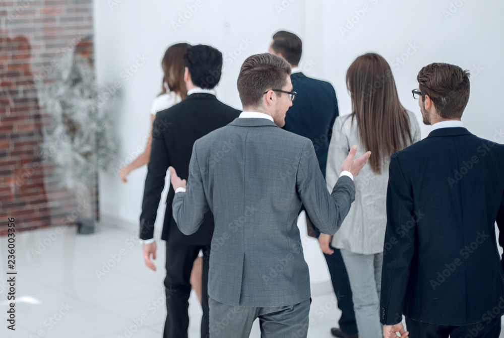 employees talk on the way to the workplace. employees talk on the way to the workplace.