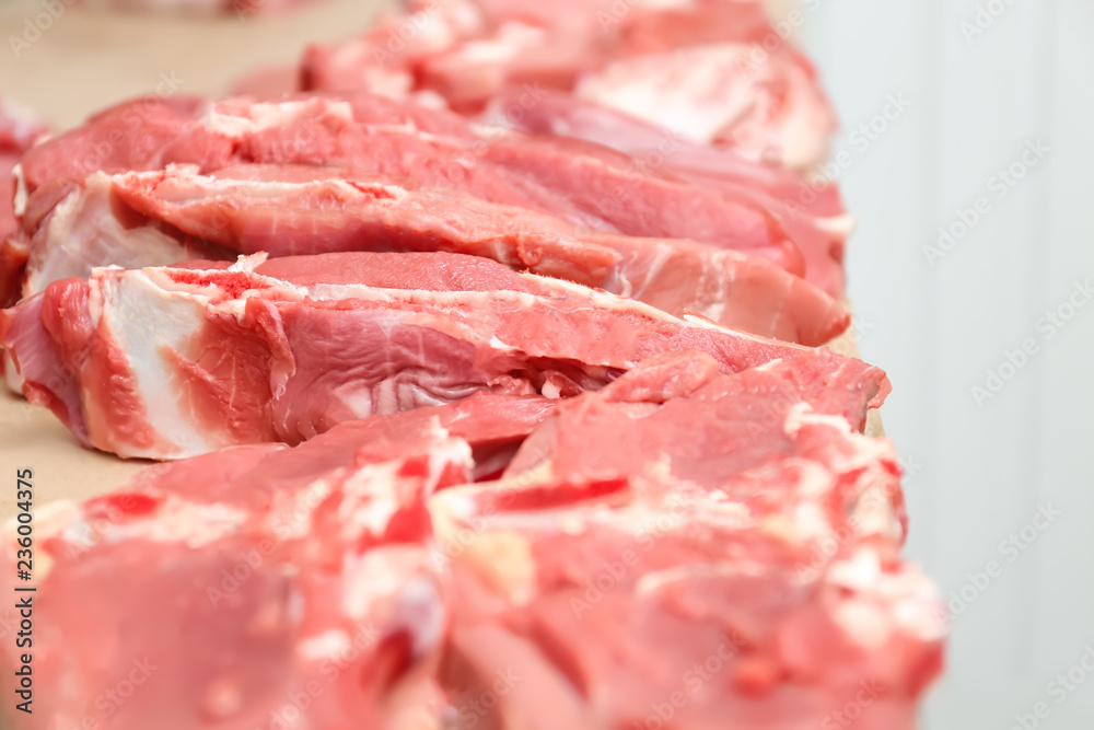 Pieces of fresh raw meat on counter in butcher shop Pieces of fresh raw meat on counter in butcher shop