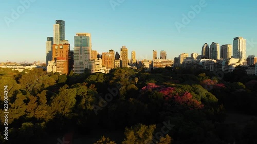 Wallpaper Mural Wide Aerial drone view of Palermo Neighborhood in Buenos Aires during sunset with city park and skyscrapers buildings. Warm orange colors. Torontodigital.ca