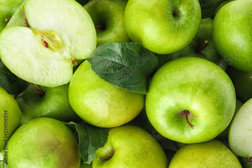 Many ripe juicy green apples as background