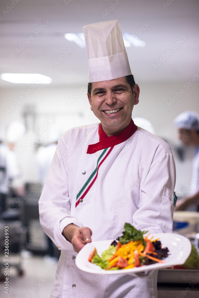 Chef showing a plate of tasty meal