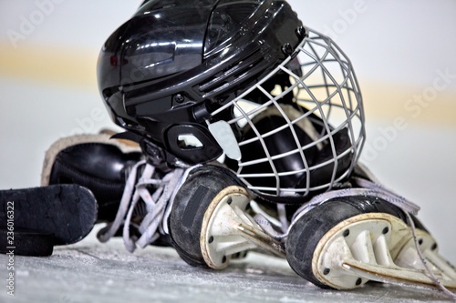 Photography Hockey Helmet, Puck, Stick and Skates on Hockey Rink