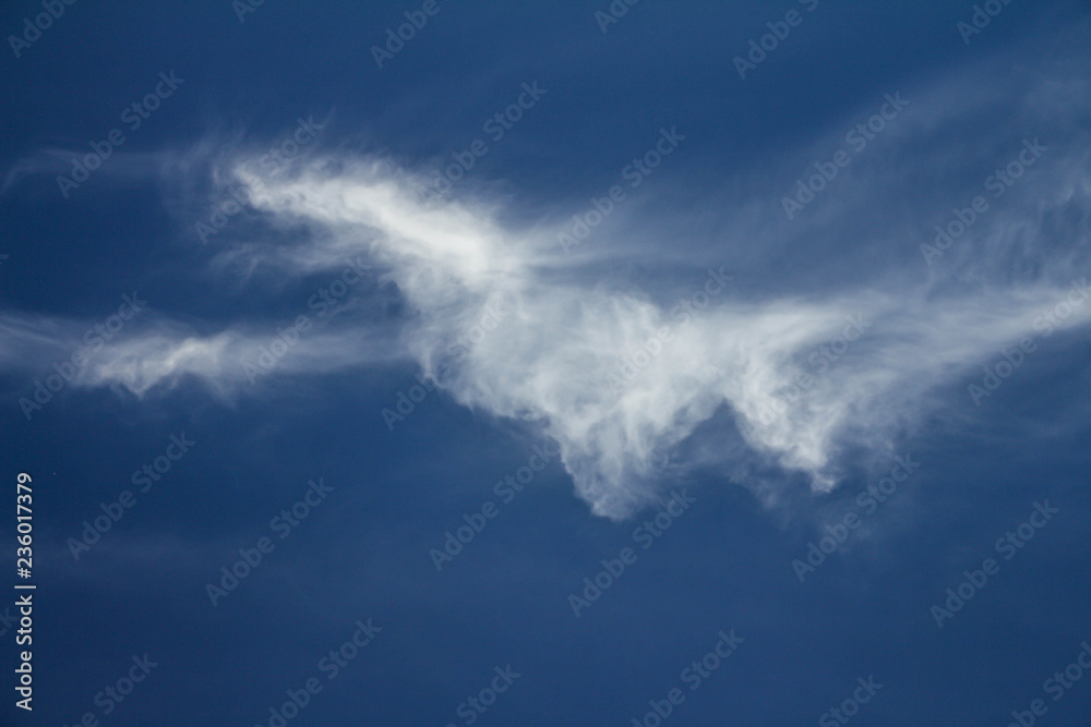 White cloud isolated on neutral blue background. Resource for designers. White cloud isolated on neutral blue background. Resource for designers.
