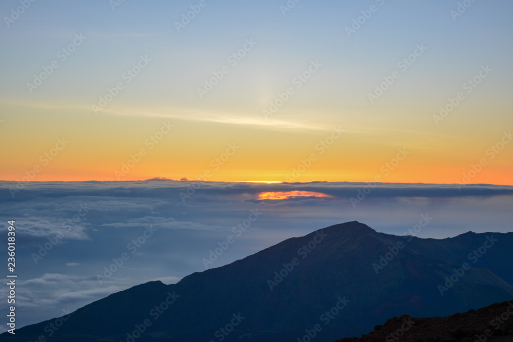 Sunrise at the summit of Haleakala volcano on the island of Maui, Hawaii.