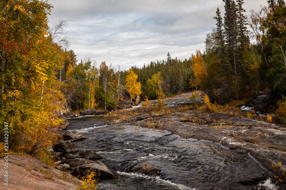 Beautiful fall foliage on the Cameron River Falls area near Yellowknife, Northwest Territories in Canada Beautiful fall foliage on the Cameron River Falls area near Yellowknife, Northwest Territories in Canada