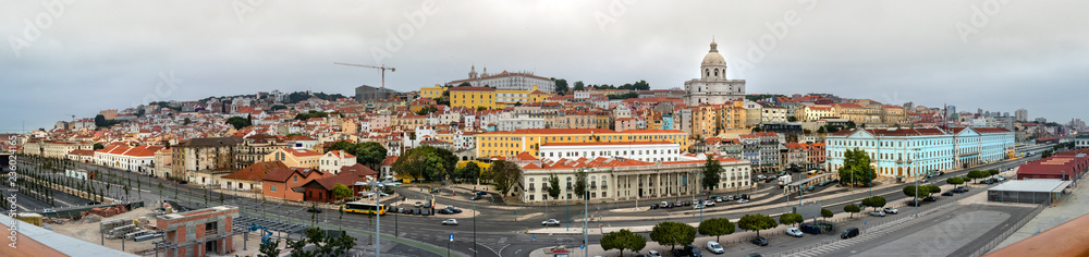 Panoramic view from the pier of the Port of Lisbon and the city center on a cloudy day.