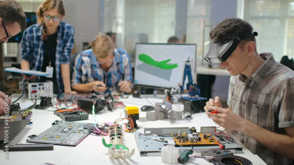 Young engineers working on scientific project Young engineers working on scientific project