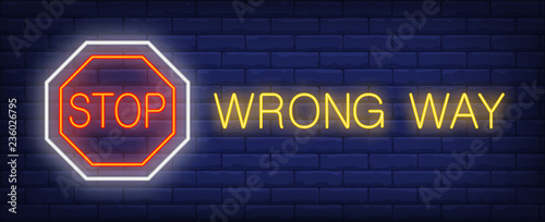 Stop, wrong way neon text with octagon sign. Caution design. Night bright neon sign, colorful billboard, light banner. Vector illustration in neon style.