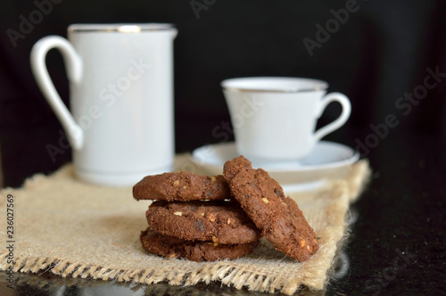 Chocolate cookies on a granite table isolated over black background