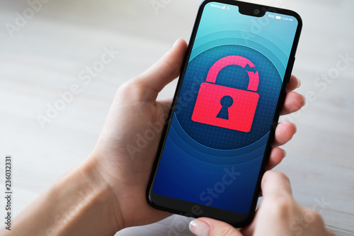 Security breach unlock padlock icon on mobile phone screen. Cyber protection concept.