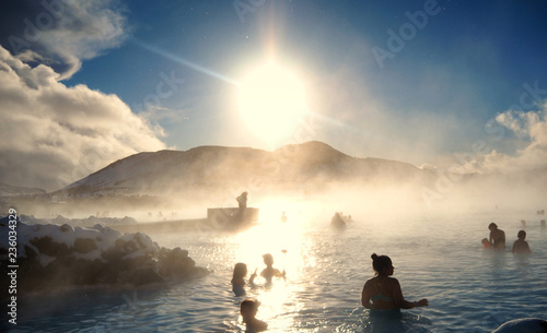 Silhouette of people swimming at the Blue Lagoon in Iceland