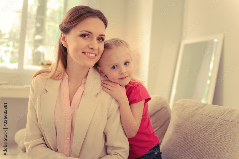 Positive nice mother and daughter looking at you Positive nice mother and daughter looking at you