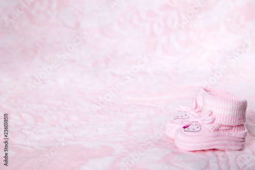Pink booties on a pink background