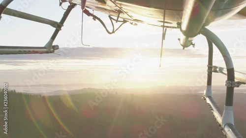 Aerial view of sunset flying by helicopter