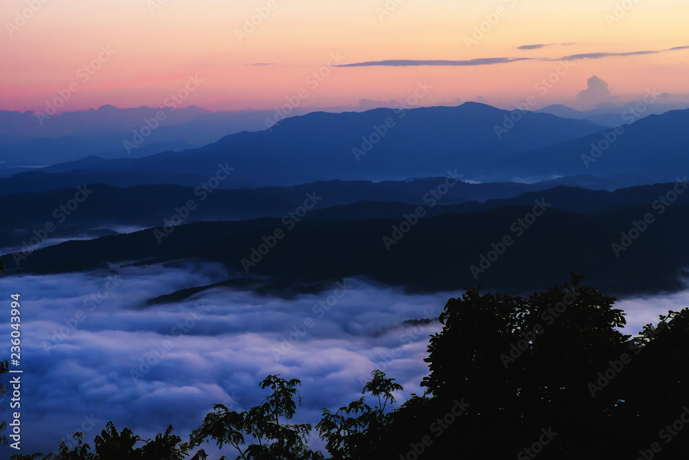 Fototapeta premium sunset overlooking mountains with Mist