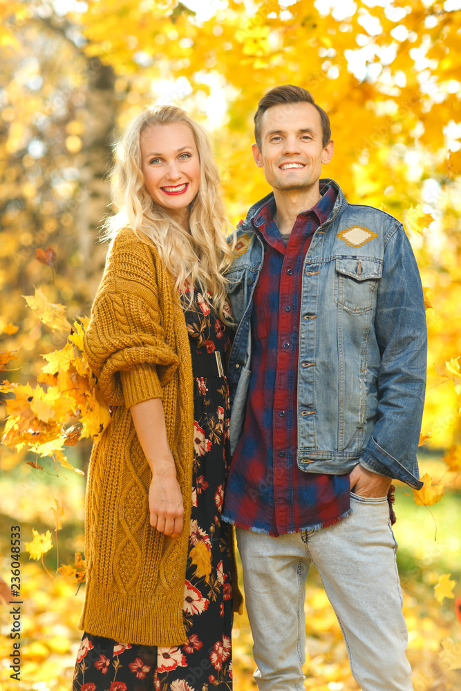 Photo of happy couple on walk in autumn forest Photo of happy couple on walk in autumn forest