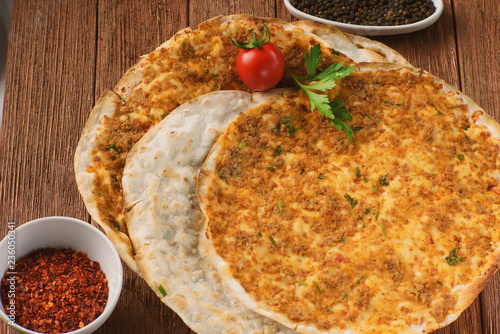 Armenian pizza, lahmajo with slices of lamb, Basil and spices photo