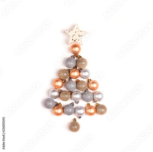 Christmas tree made of small decorative gold and silver balls on white background.