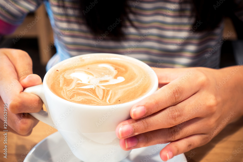 Hot coffee latte on a wooden table. Hot coffee latte on a wooden table.