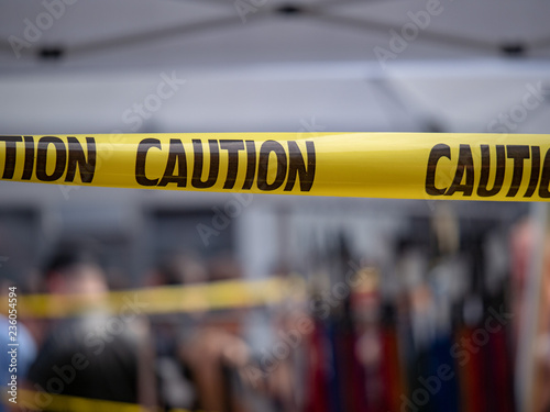 Yellow caution tape, do not enter area, hanging blocking area