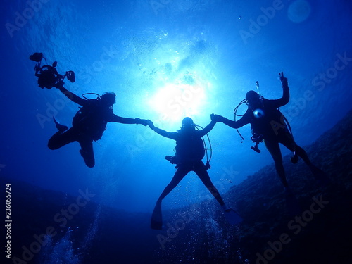 Three Divers in The Sea