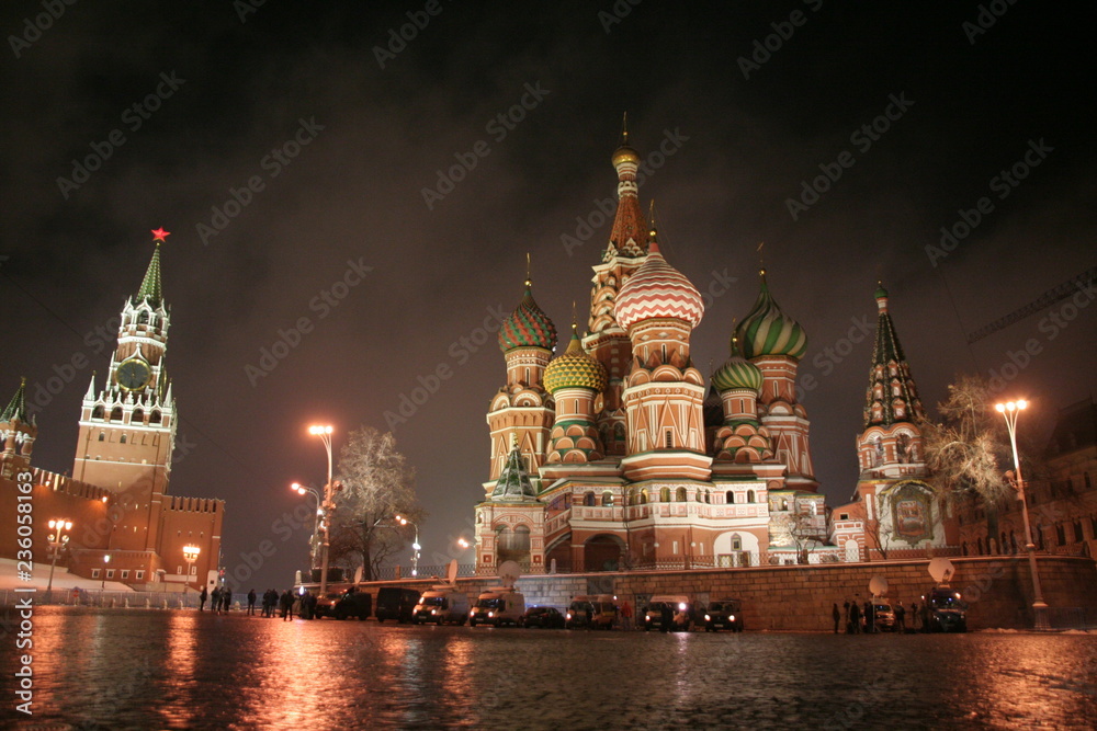 Obraz premium Red square in november night lights, first snow, fog, wet stones, Kremlin tower and St.Basil Cathedral