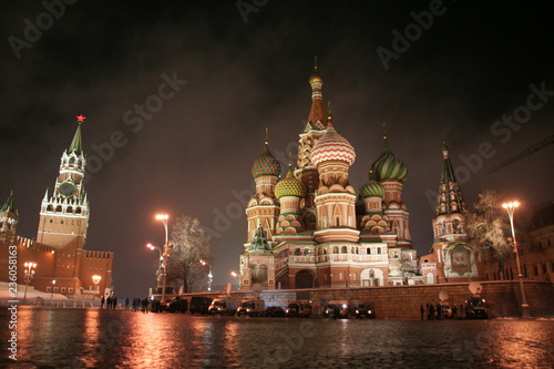 Red square in november night lights, first snow, fog, wet stones, Kremlin tower and St.Basil Cathedral