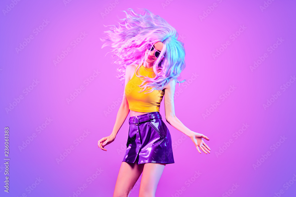 Fashion. Disco Party girl dance in neon light
