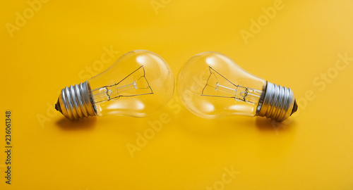 close up view of white light bulb isolated on yellow