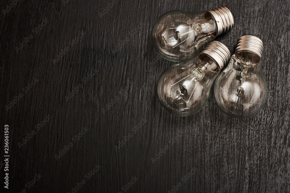 light bulbs on a wood background light bulbs on a wood background