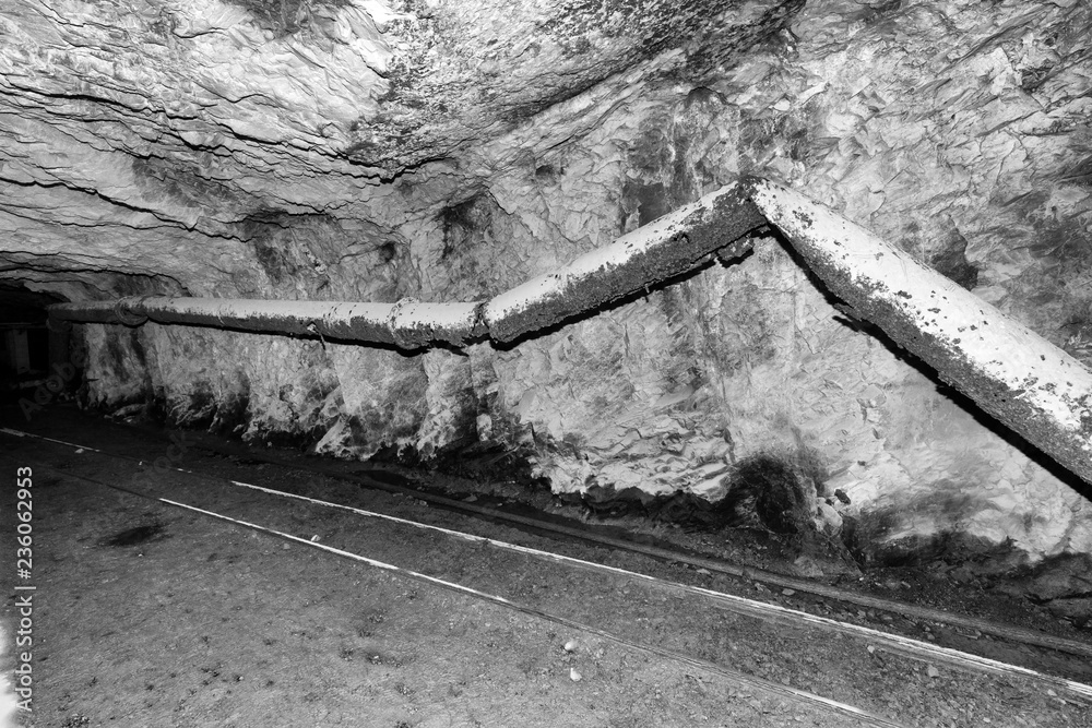 Tunnel with tracks in an abandoned cement mine in Switzerland