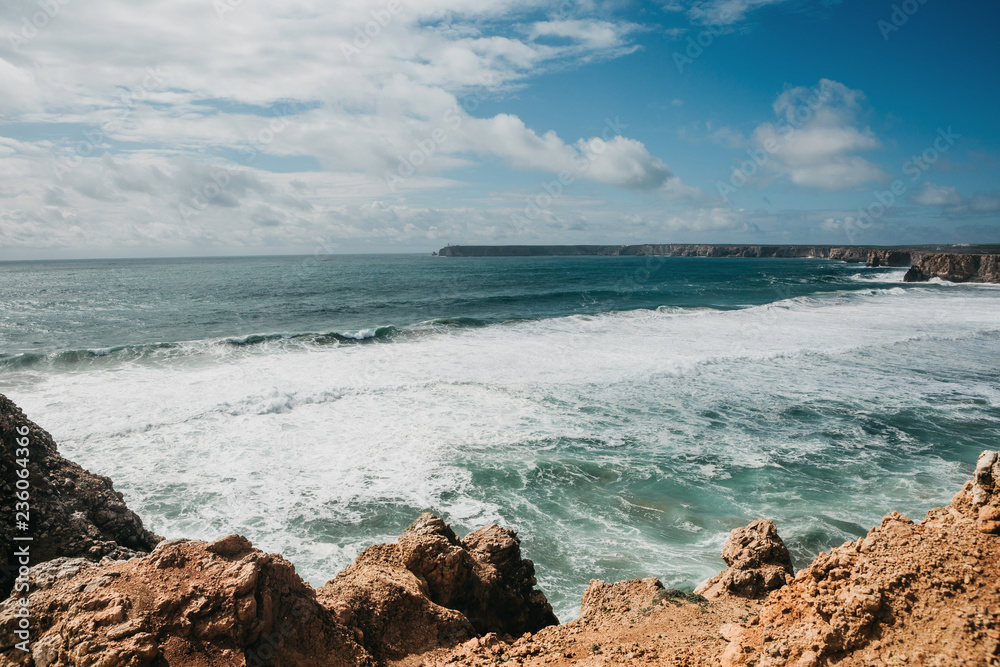 Beautiful view of the Atlantic Ocean and coastal cliffs off the coast of Portugal on a sunny day. Beautiful view of the Atlantic Ocean and coastal cliffs off the coast of Portugal on a sunny day.