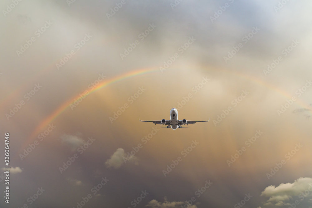 Airplane and beautiful rainbow in the sky Airplane and beautiful rainbow in the sky