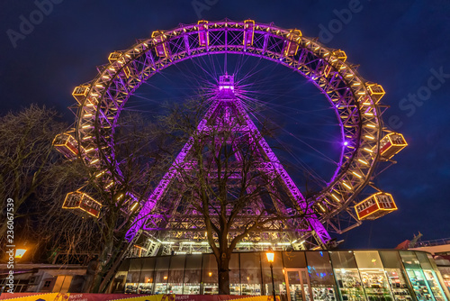 Vienna, Austria - December 29, 2017. Giant Ferris Wheel in Vienna amusement Prater park in Christmas Evening. Famous viennese Riesenrad carousel illuminated at night.