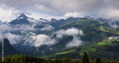 Kitzsteinhorn and Maiskogel in summer. Austrian alpine mountains with clouds. Countryside, landscape