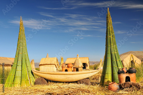 Reed boat on Island of Uros. Titicaca (Titiqaqa) is a lake in the Andes on the border of Peru and Bolivia. photo