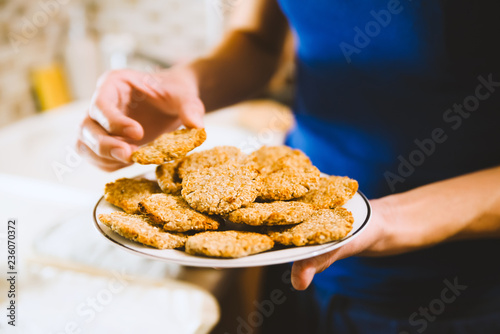 Oatmeal cookies on woman hand