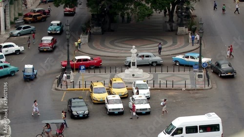 Elevated clip of classic American cars on Paseo del Prado in Havana Cuba photo