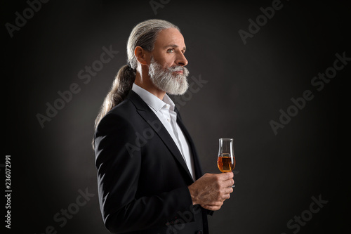 Elderly businessman with gl...