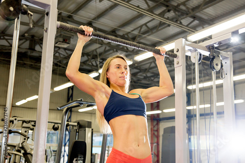 sporty girl doing exercises in a gym