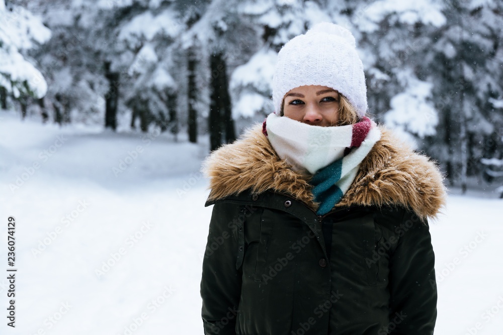 Obraz premium portrait of a young woman in the winter in a warm clothing.