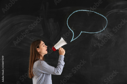 Young woman with megaphone ...