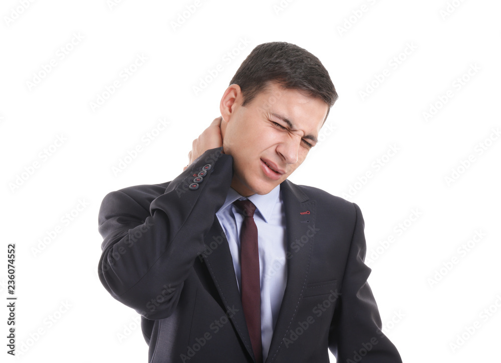Young businessman suffering from neck pain on white background Young businessman suffering from neck pain on white background