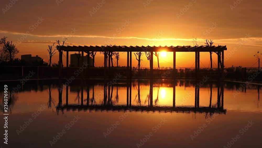 Swimming pool in the evening at sunset, beautiful scenic view Swimming pool in the evening at sunset, beautiful scenic view